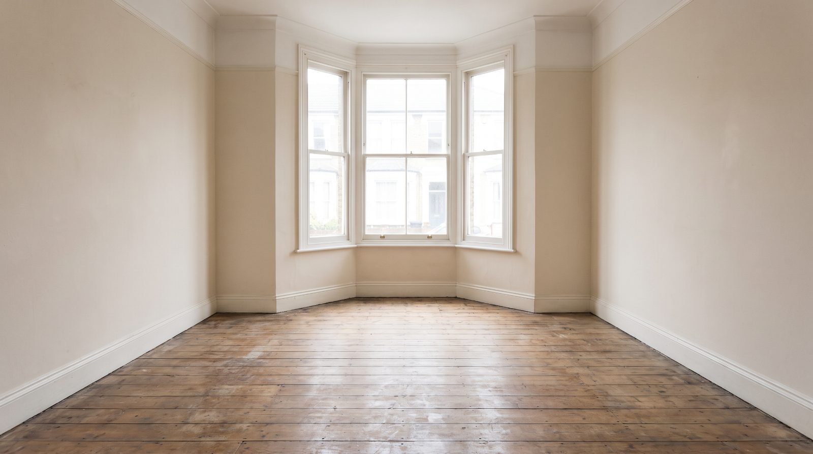 An empty living room in a rental property between tenancies
